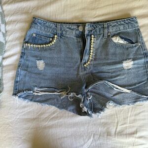 Stylish Blue Denim Shorts with Gold Accents